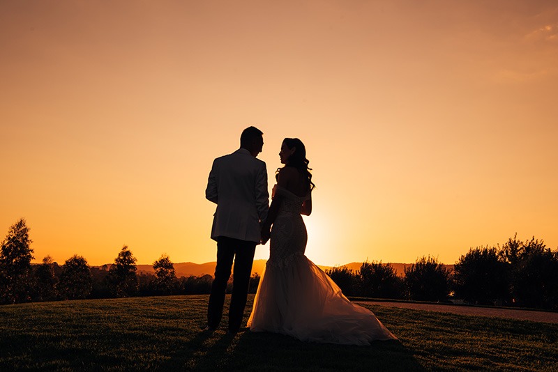 Couple during sunset on their wedding day